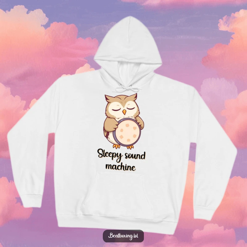 Funny owl hoodie showing a sleepy character mimicking a kick drum with its belly, a cozy humorous design.