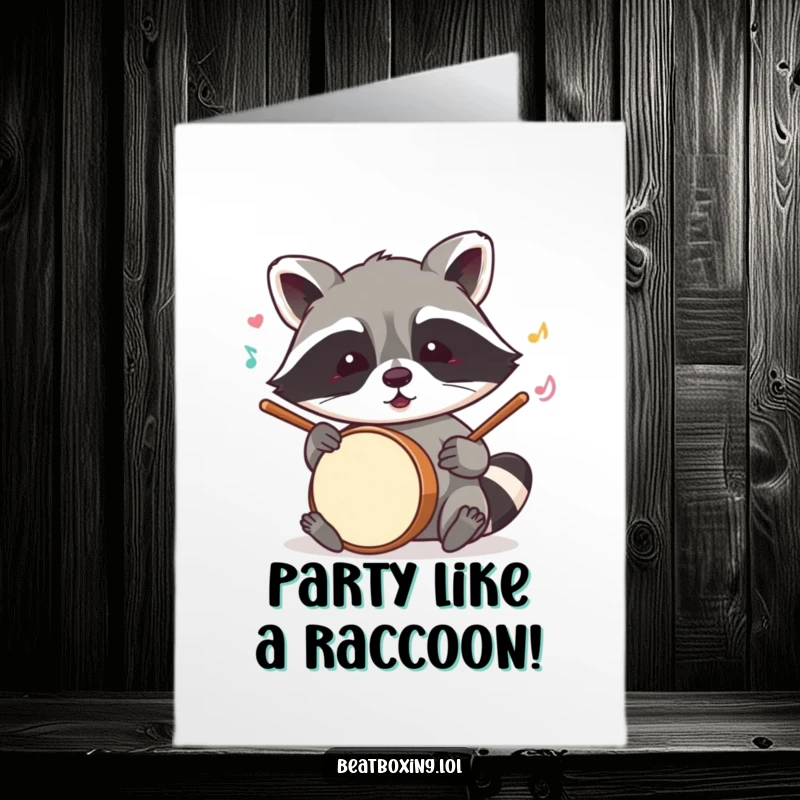 Funny free printable birthday card featuring a mischievous raccoon enthusiastically drumming with its paws.