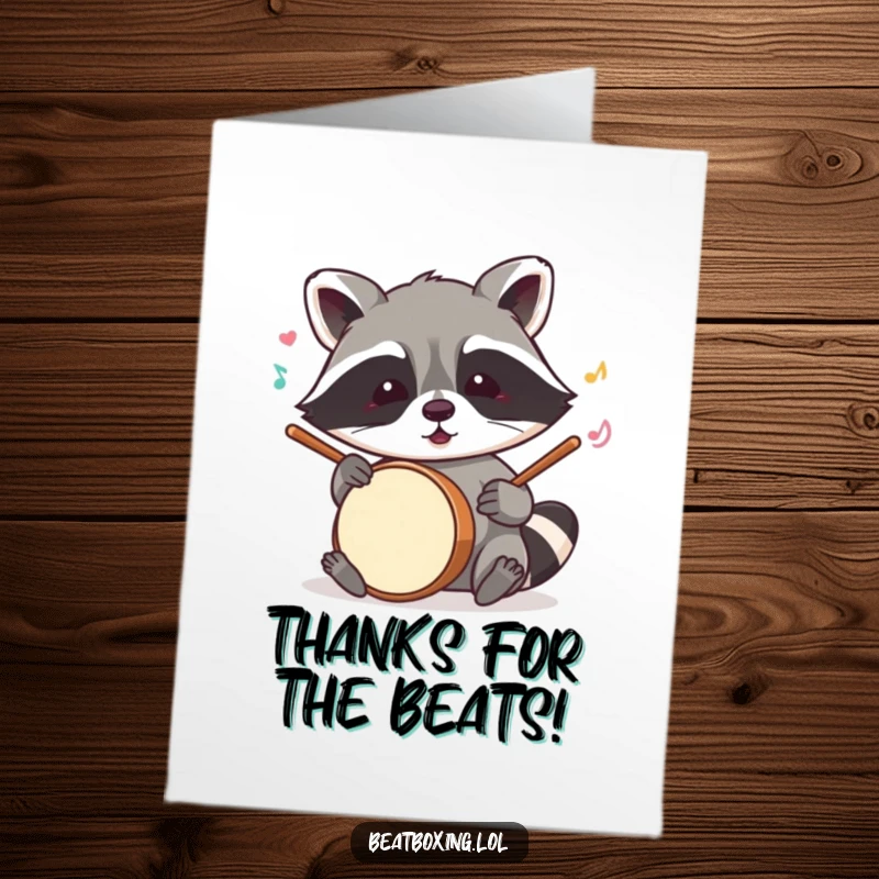 Funny free printable thank you card depicting a mischievous raccoon creating drum sounds with its paws.