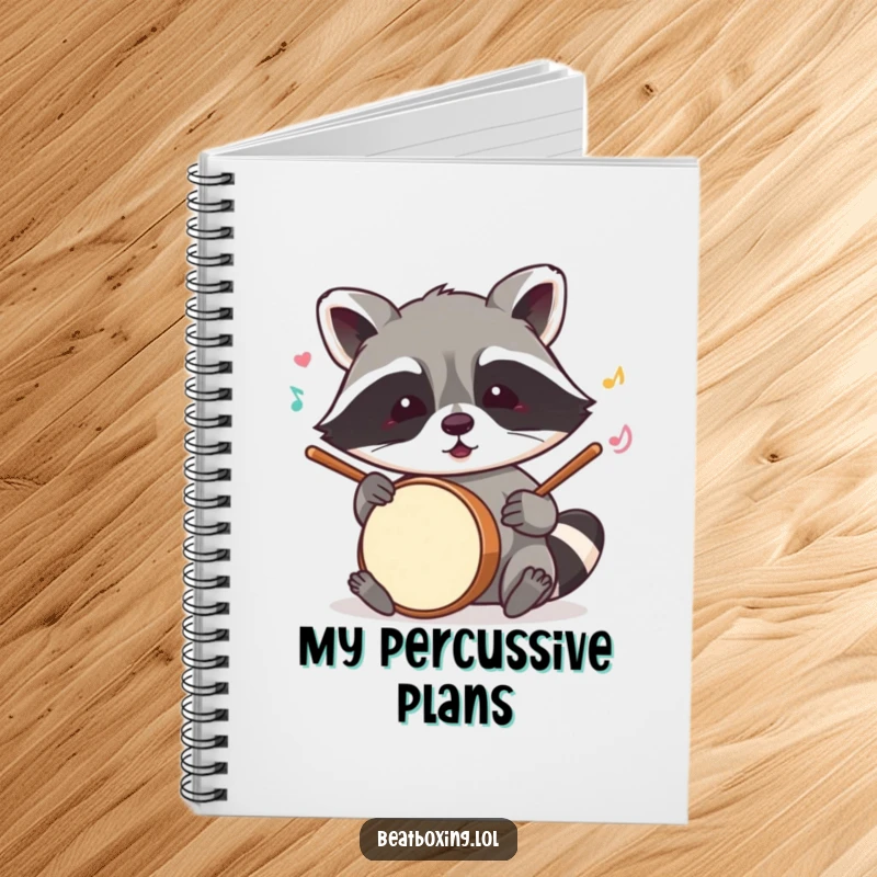 Funny raccoon notebook featuring a mischievous character mimicking drum sounds with its paws, perfect for jotting down musical ideas.